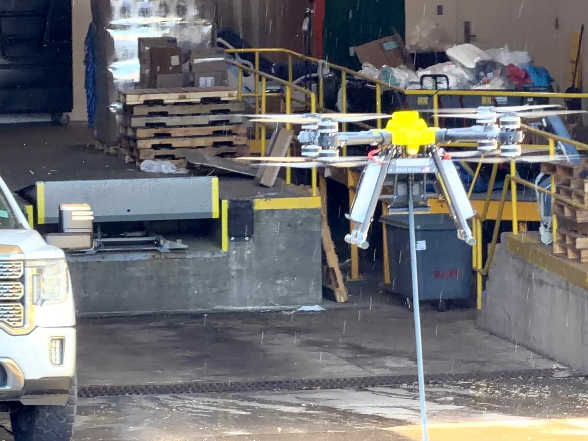 Drone cleaning equipment staged at an industrial site.