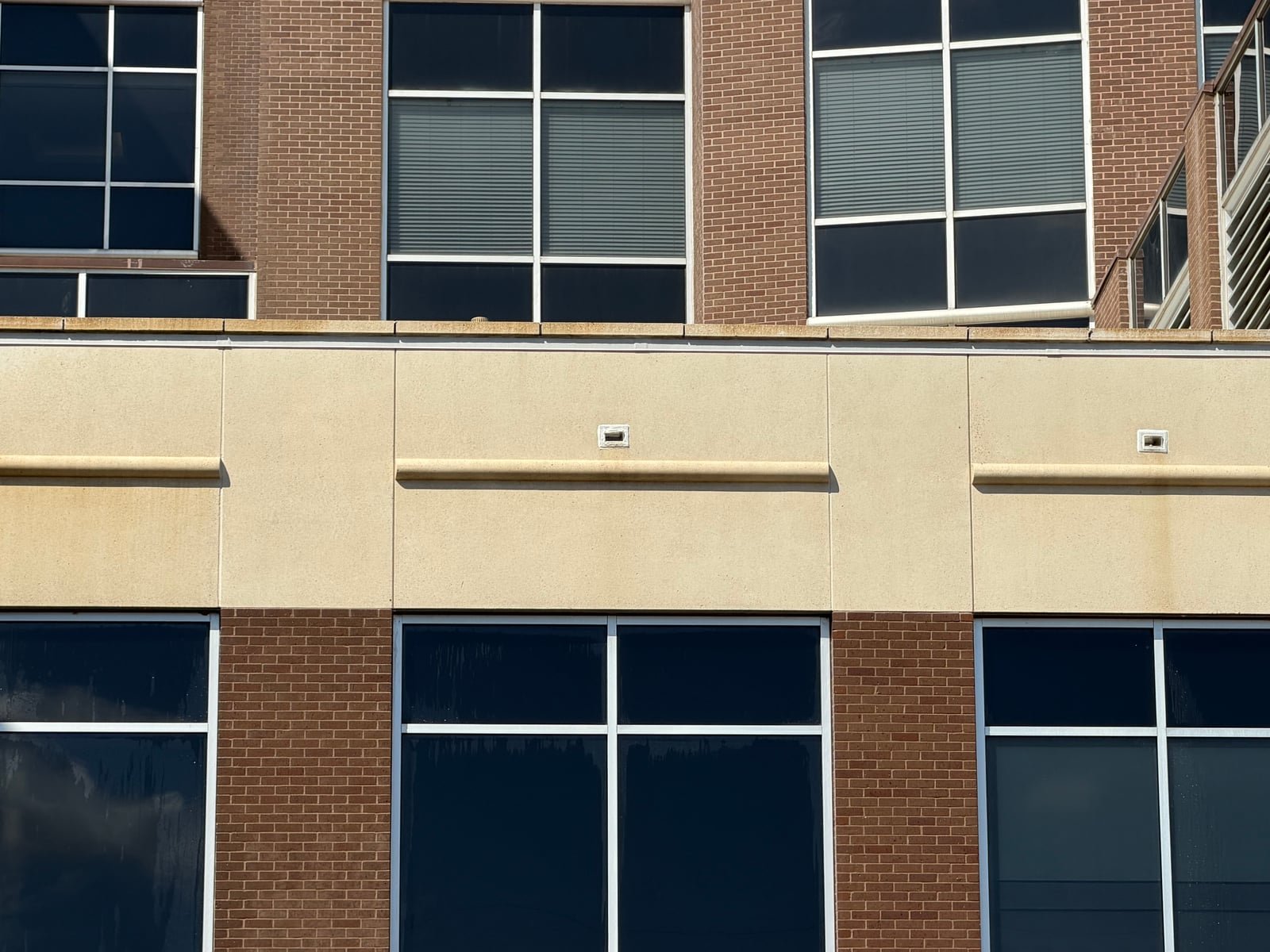 Completed commercial facade surface following exterior cleaning work.