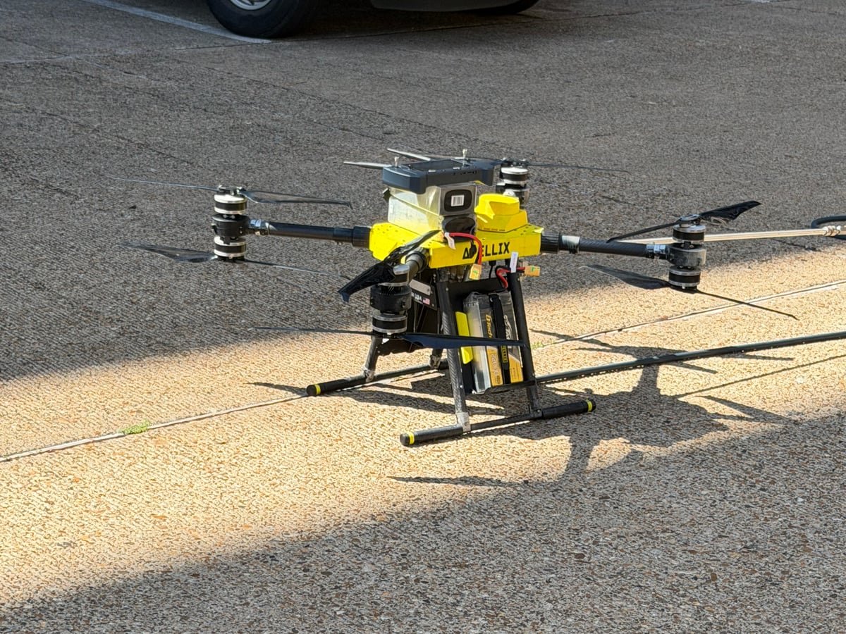 Rotag PT Services cleaning drone positioned on the ground before operation.